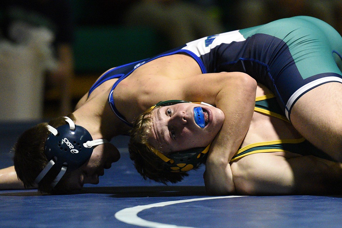 Glacier&#146;s Caden Gilmond, top, won by decision over Whitefish&#146;s Camren Ross at 160 pounds. (Casey Kreider/Daily Inter Lake)