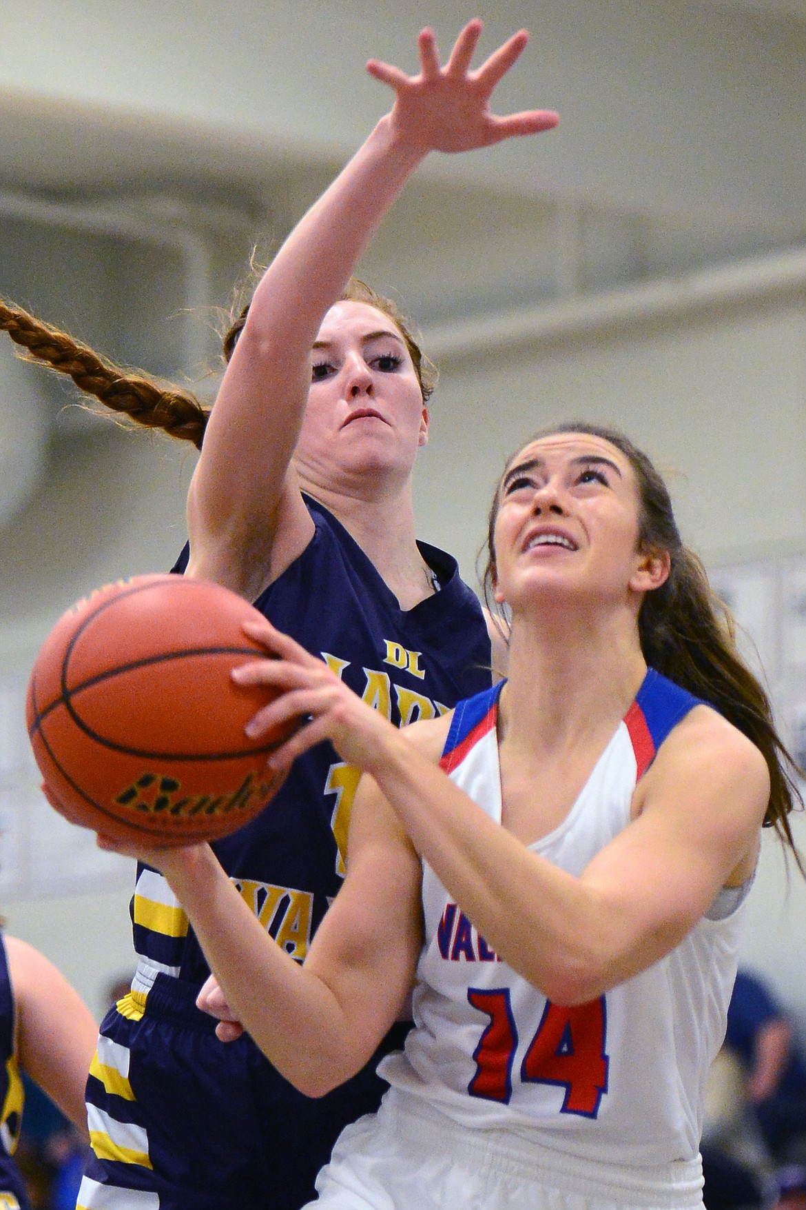 Bigfork's Abby Ellison looks to shoot with Deer Lodge's Darcy Walker defending. (Casey Kreider/Daily Inter Lake)