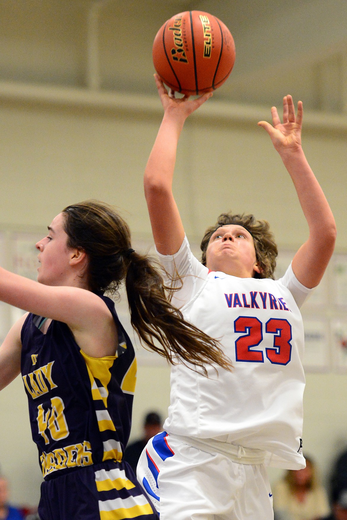 Bigfork's Rakiah Grende drives to the hoop with Deer Lodge's Kamryn Johnson defending. (Casey Kreider/Daily Inter Lake)