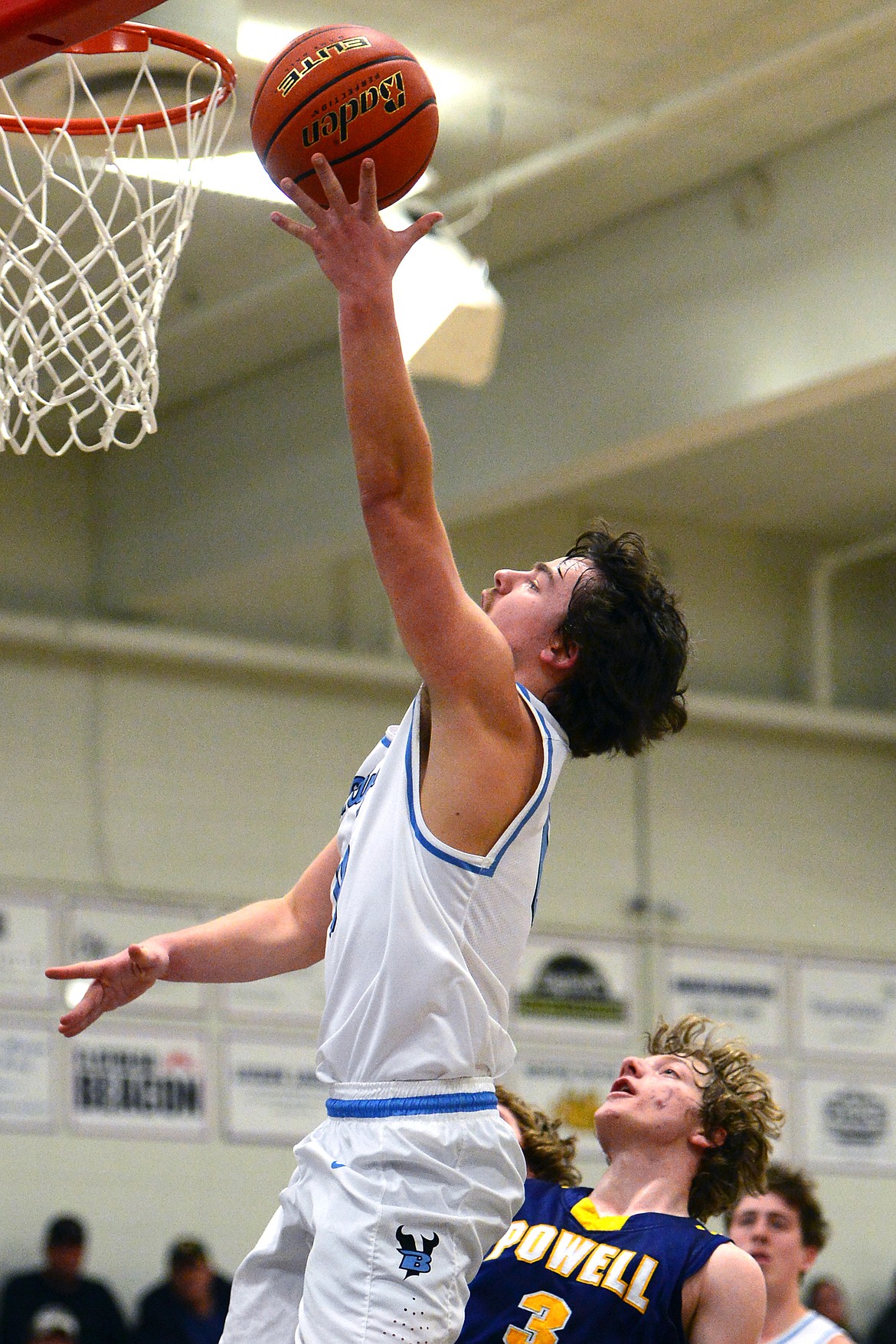 Bigfork's Anders Epperly lays in two points ahead of Deer Lodge's Judd Applegate. (Casey Kreider/Daily Inter Lake)