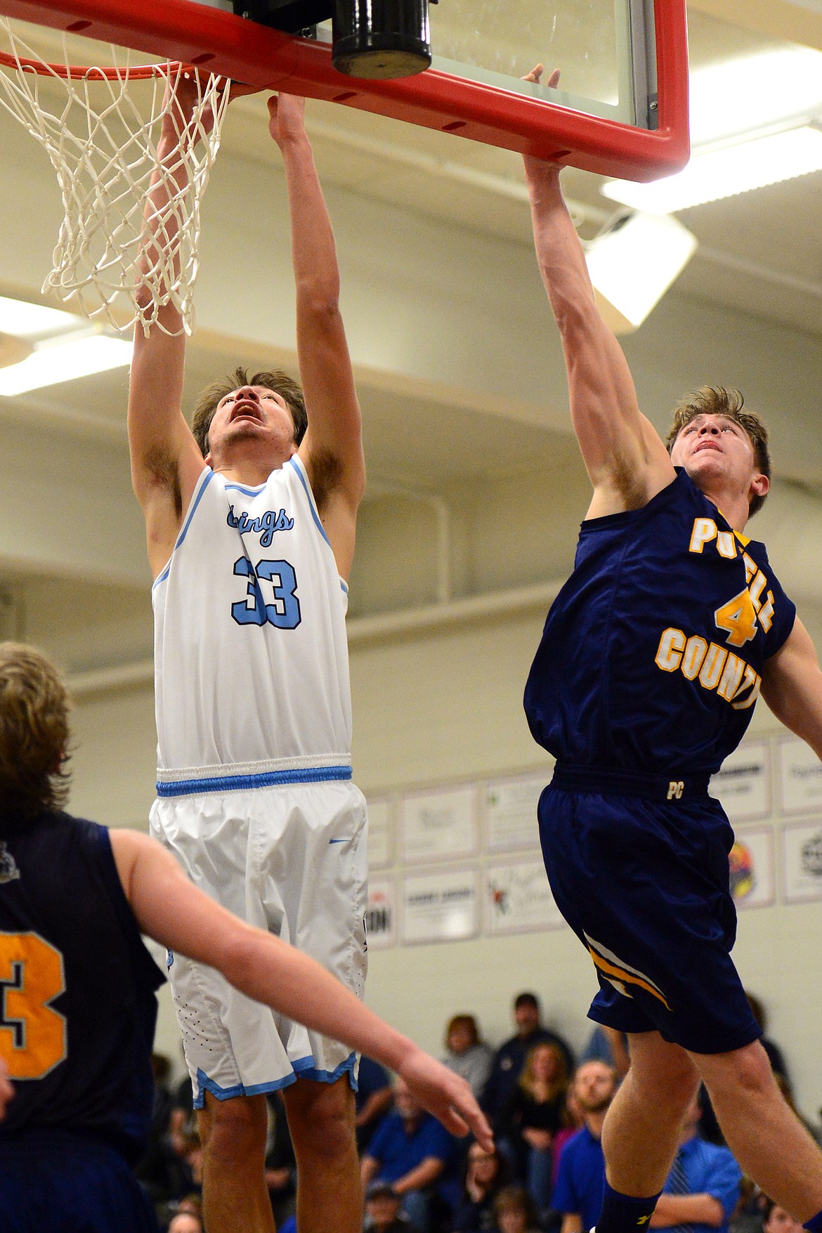 Bigfork's Beau Santisteven can't get a dunk to fall with Deer Lodge's Greydon Nicholson defending. (Casey Kreider/Daily Inter Lake)