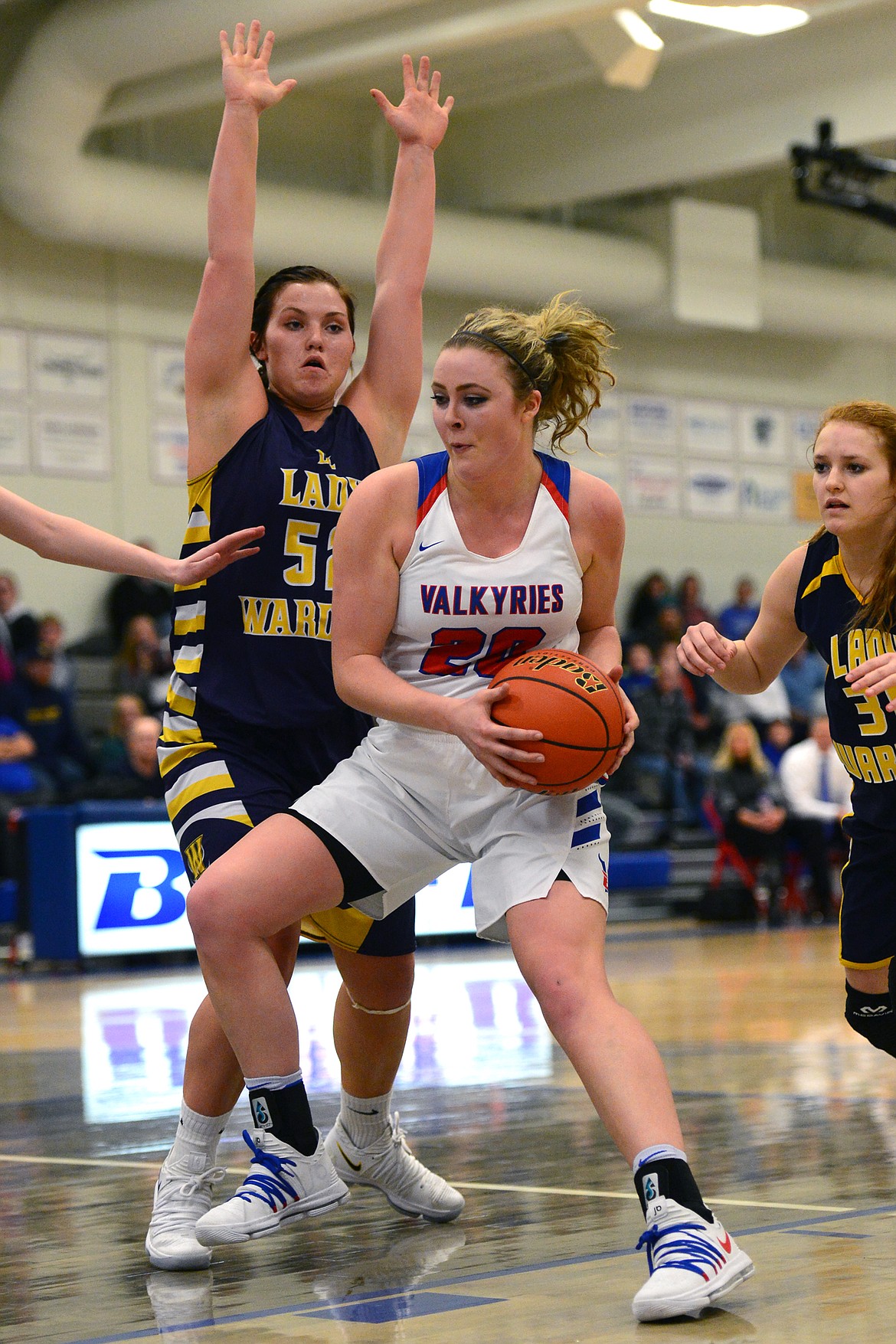 Bigfork's Jaime Berg works in the post against Deer Lodge's Ariel Clark. (Casey Kreider/Daily Inter Lake)