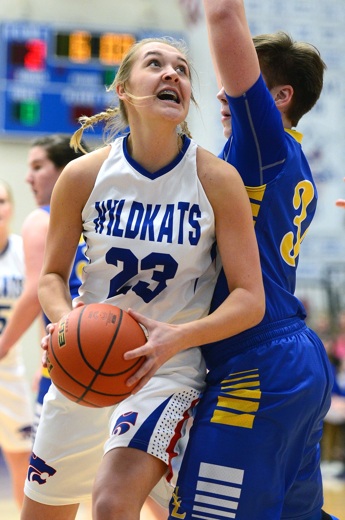 Columbia Falls' Ryley Kehr looks to shoot with Libby's Shannon Reny defending. (Casey Kreider/Daily Inter Lake)