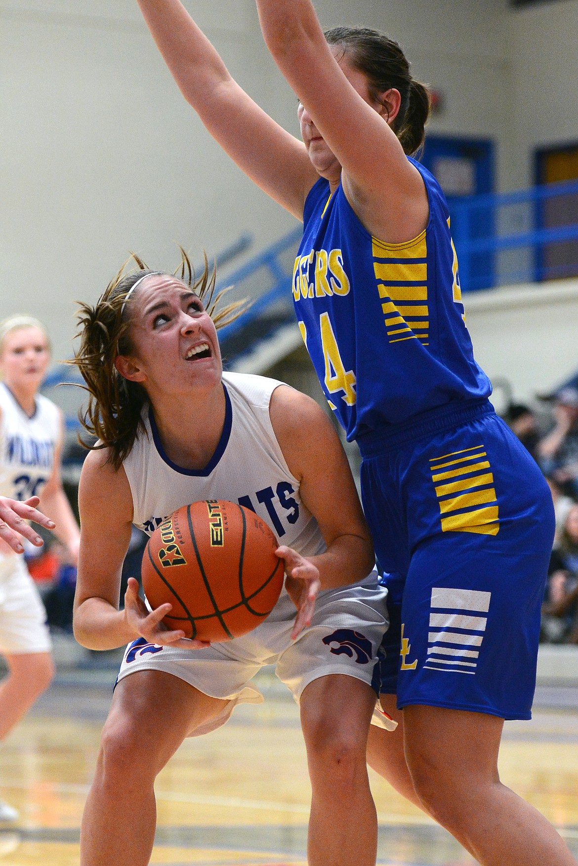 Columbia Falls' Hannah Gedlaman looks to shoot with Libby's Brooklyn Rainer defending. (Casey Kreider/Daily Inter Lake)