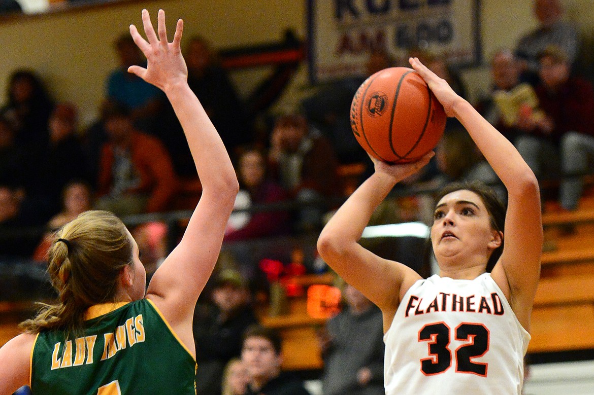 Flathead&#146;s Taylor Henley shoots over Whitefish defender Kit Anderson. (Casey Kreider/Daily Inter Lake)