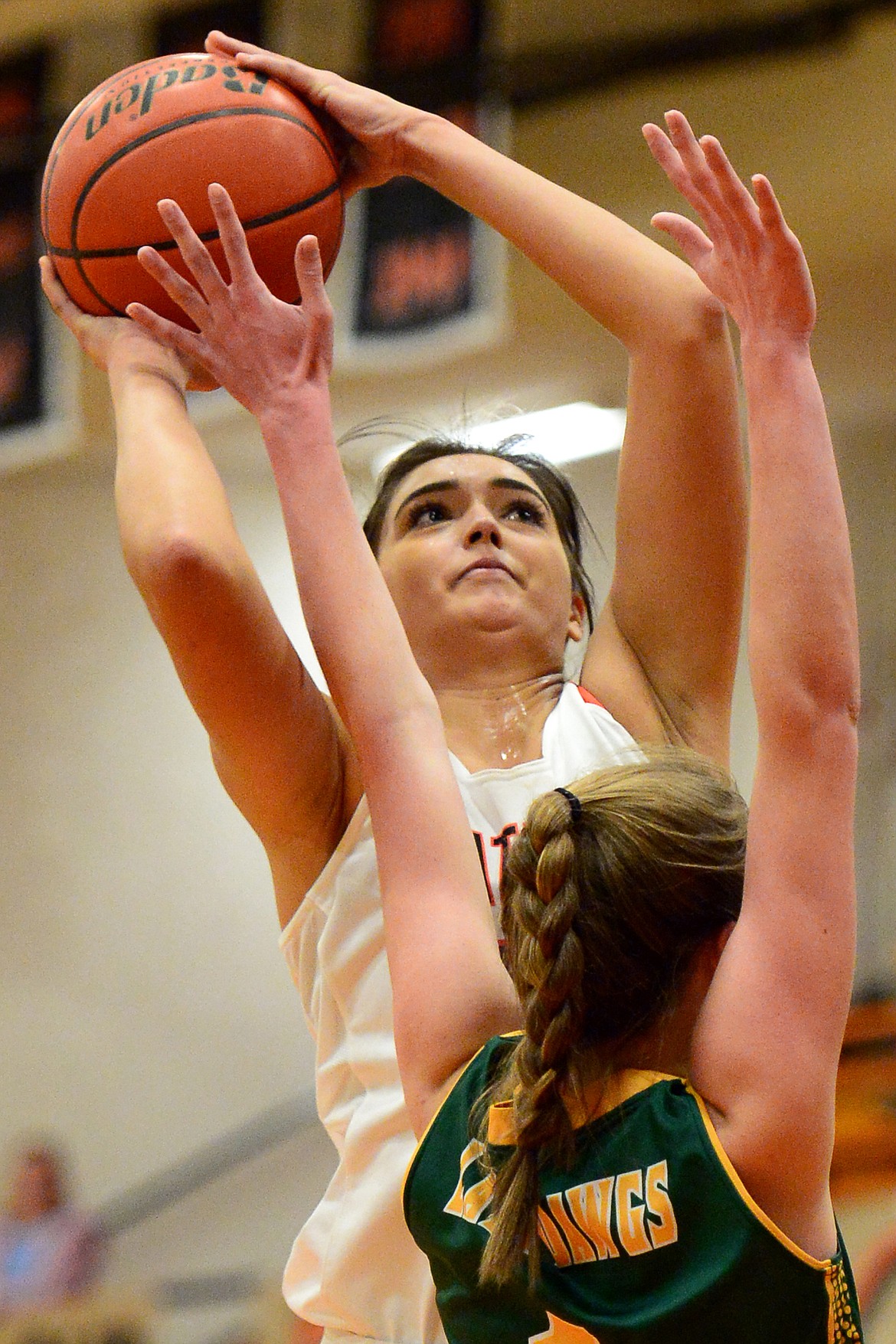 Flathead&#146;s Taylor Henley shoots over Whitefish defender Kit Anderson. (Casey Kreider/Daily Inter Lake)