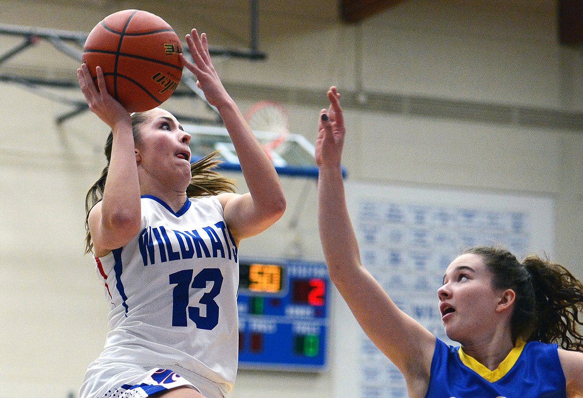 Columbia Falls' Hannah Gedlaman looks to shoot with Libby's Emma Gruber defending. (Casey Kreider/Daily Inter Lake)