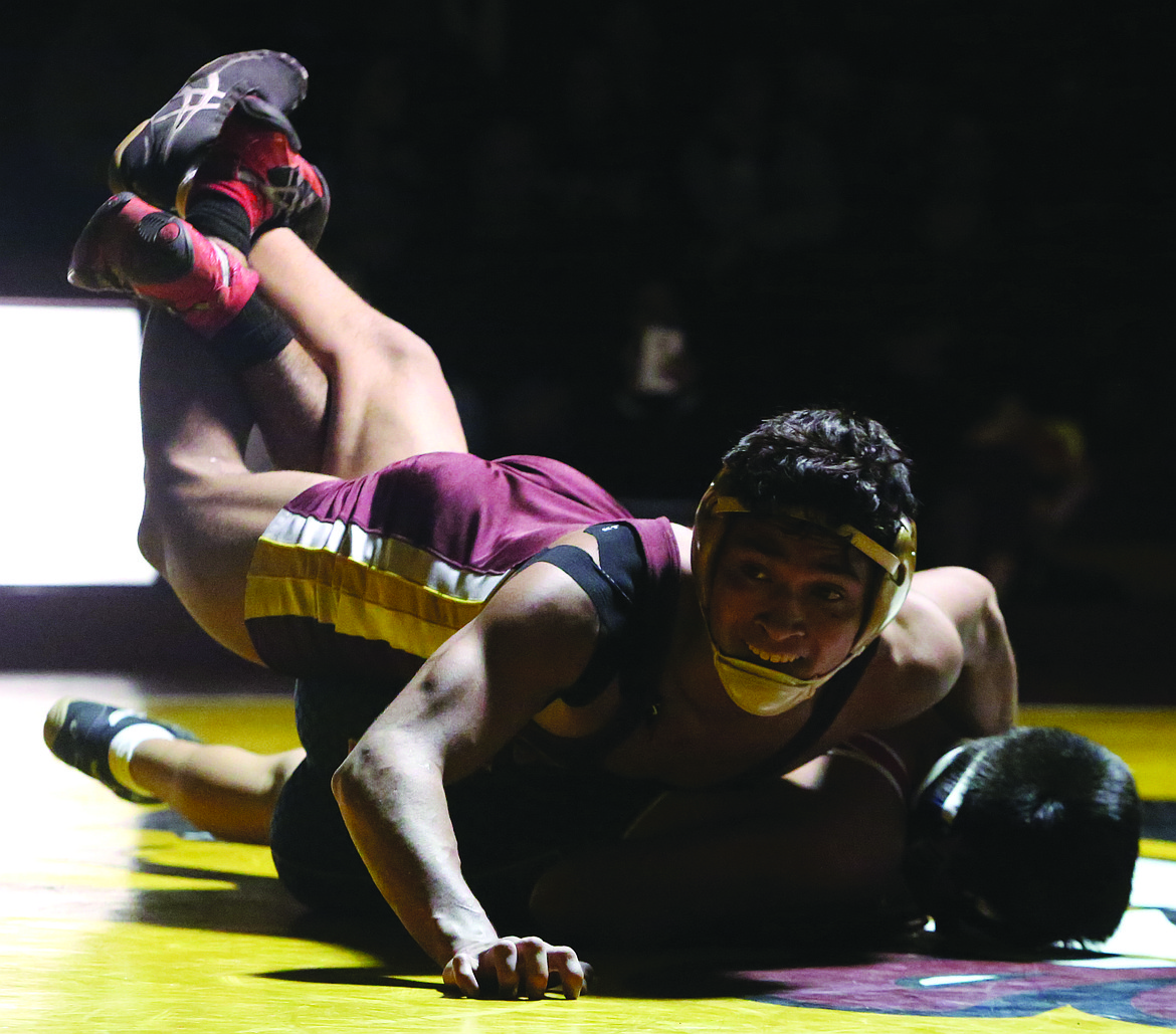 Connor Vanderweyst/Columbia Basin Herald
Moses Lake's Cruz Vasquez works to pin Eisenhower's Erick Contreras.