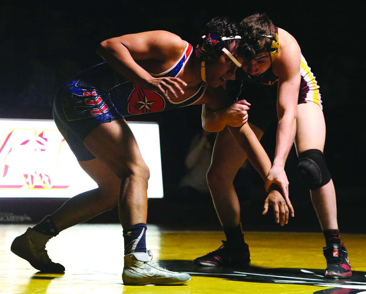 Connor Vanderweyst/Columbia Basin Herald
Moses Lake 145-pounder Christien Knopp (right) controls the arm of Eisenhower's Damian Camacho.