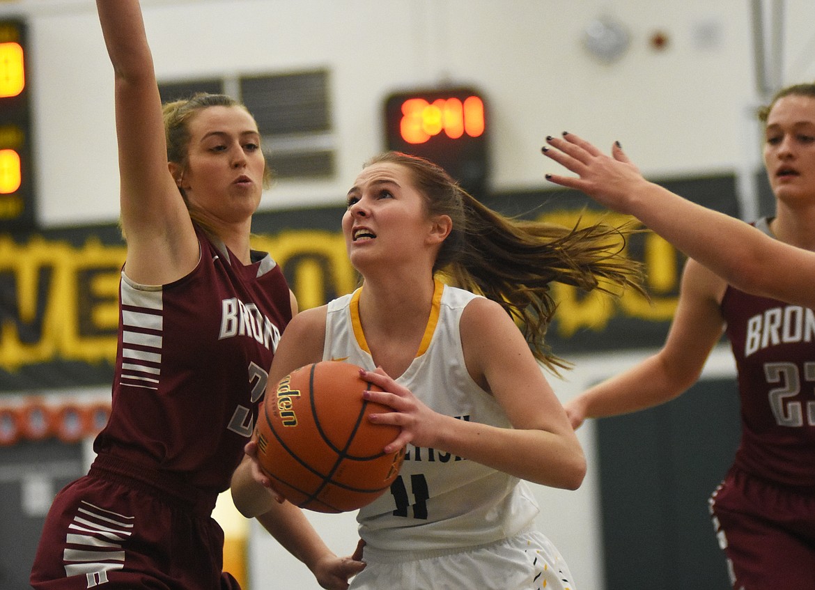 Claire Carloss drives to the basket during Saturday&#146;s loss to Hamilton. (Daniel McKay/Whitefish Pilot)