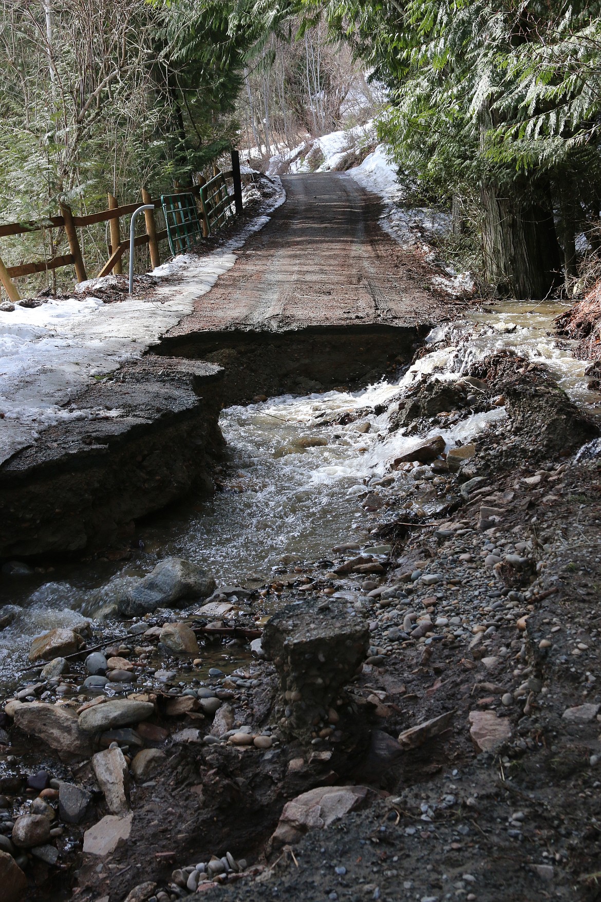 Photo by Mandi Bateman
A county water culvert, clogged with debris from massive flooding in March, washes out a driveway at 2787 Westside Road.