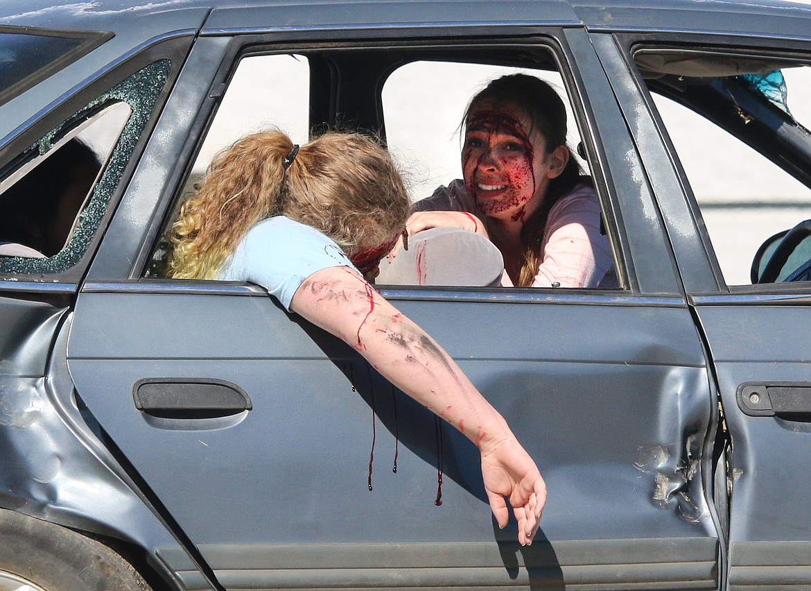 Photo by Mandi Bateman
Principal Kevin Dinning and Boundary County law enforcement simulated a gruesome crash scene using two wrecked vehicles, to educate Bonners Ferry High School students in May 2017.