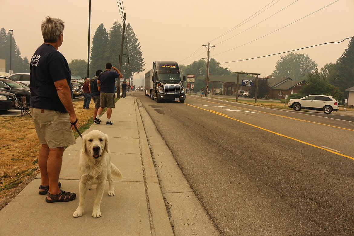 Photo by Mandi Bateman
Saluting The Wall That Heals as it passed through Bonners Ferry on Memorial Day, despite the thick smoke from wildfires.