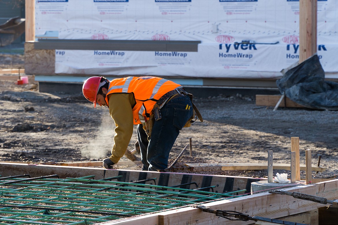 A Martel Construction employee hammers away at the Center for Sustainability and Entrepreneurship. (Daniel McKay/Whitefish Pilot)