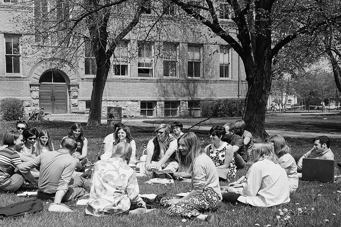 Early Flathead Valley Community College students study on the lawn of &#147;Montana Hall&#148; known as Central School when the campus was located in downtown Kalispell. (Photo courtesy of FVCC)