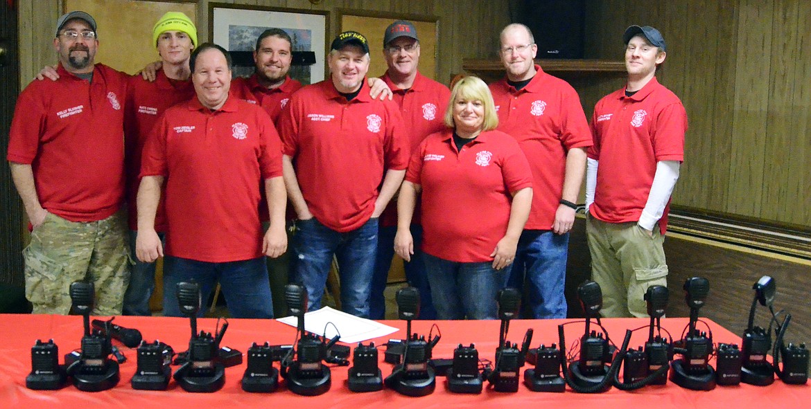 The Plains City Fire Department are all smiles thanks to receiving their new equpiment at the annual Christmas Party (Erin Jusseaume/ Clark Fork Valley Press)