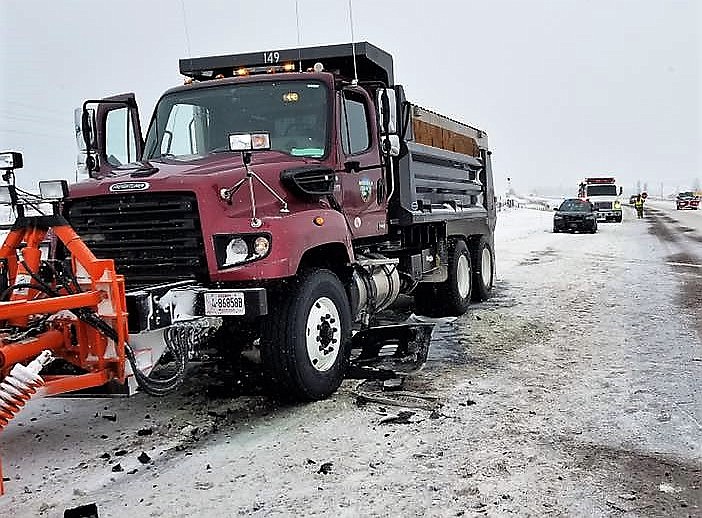 A snow plow was damaged Dec. 28 when it collided with a passenger car trying to pass. Montana Highway Patrol reminds drivers to use caution when passing plows. (Photo courtesy of Frenchtown Volunteer Fire Department)