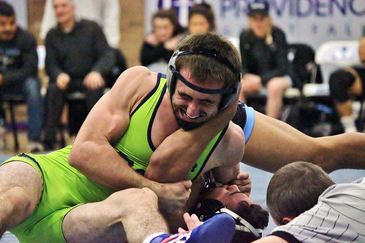 Shonn Roberts battles against an opponent from Warner Pacific. Roberts is currently ranked fifth in the nation in the NAIA 149-pound division. (Tom Wylie photo)