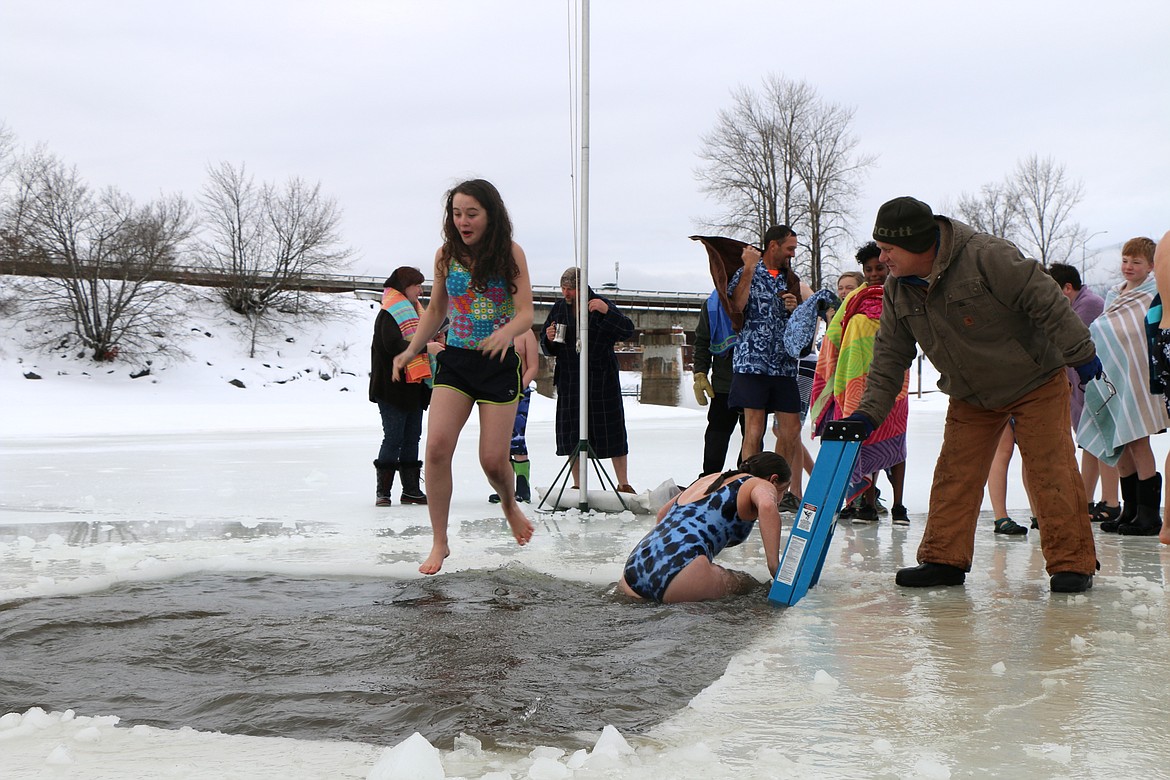 (Photo by CAROLINE LOBSINGER)
A Polar Bear Plunge participant grimaces as she into Lake Pend Oreille during in Boy Scout Troop 111's annual event Monday on New Year's Day.