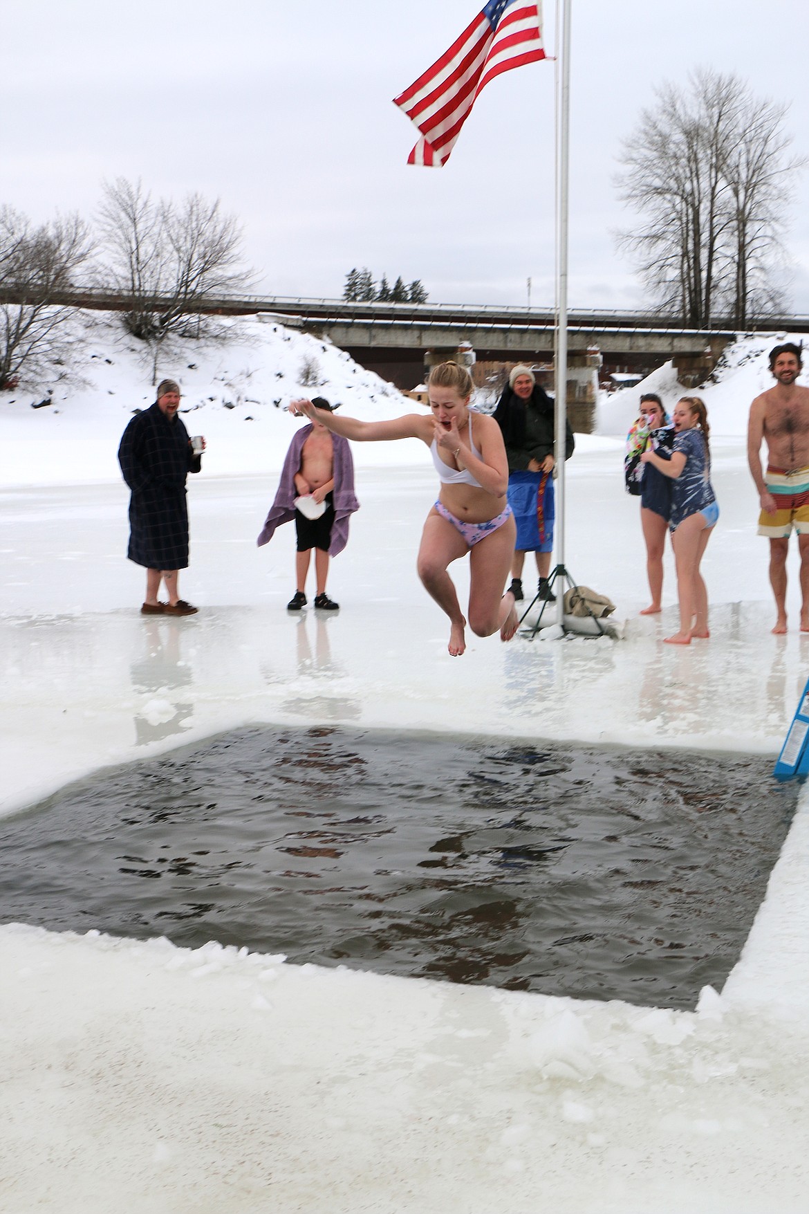 (Photo by CAROLINE LOBSINGER)
A Polar Bear Plunge participant jumps into Lake Pend Oreille during Boy Scout Troop 111's annual event Monday on New Year's Day.