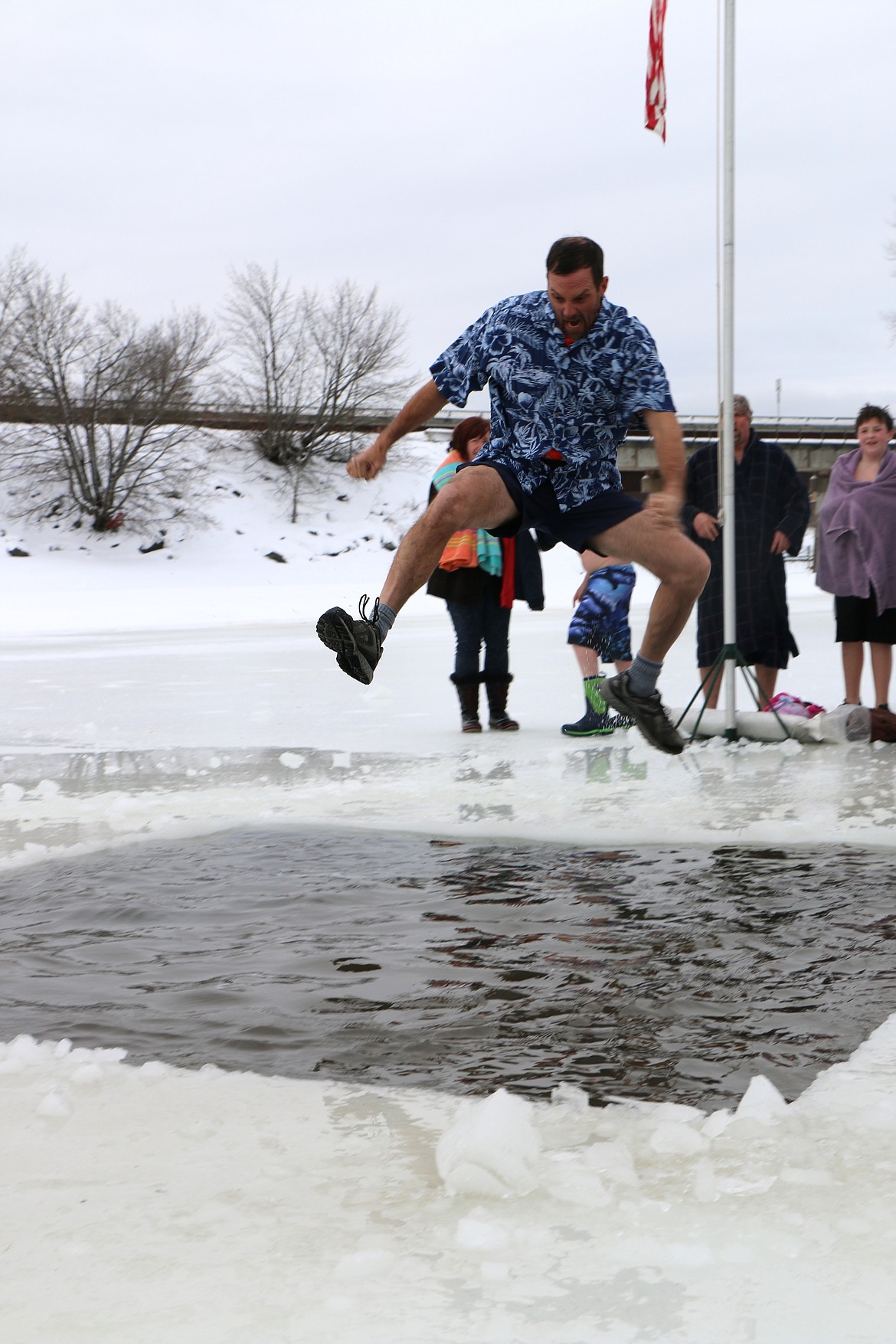 (Photo by CAROLINE LOBSINGER)
A Polar Bear Plunge participant jumps into Lake Pend Oreille during Boy Scout Troop 111's annual event Monday on New Year's Day.