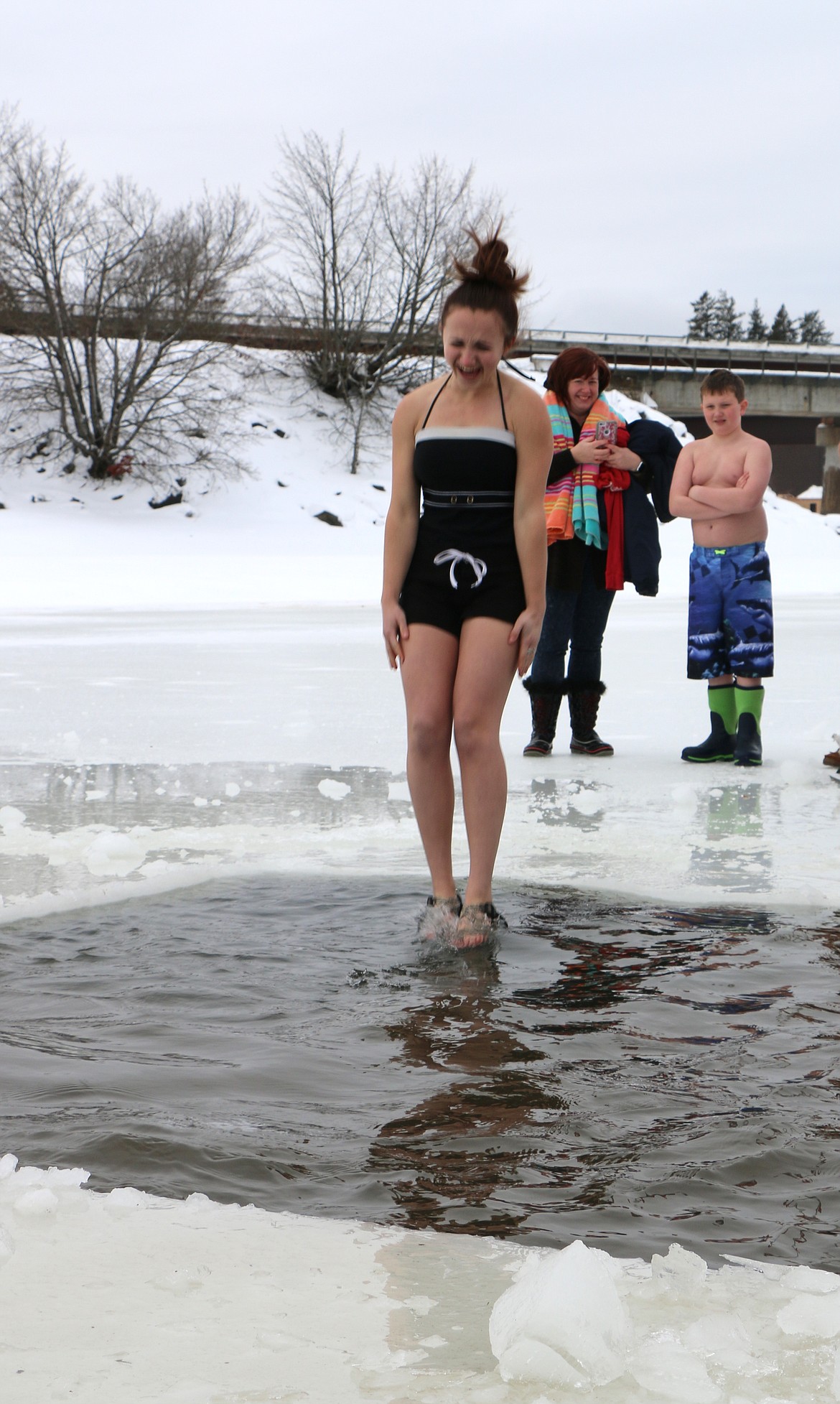 (Photo by CAROLINE LOBSINGER)
A Polar Bear Plunge participant squeals as she jumps into Lake Pend Oreille during Boy Scout Troop 111's annual event Monday on New Year's Day.