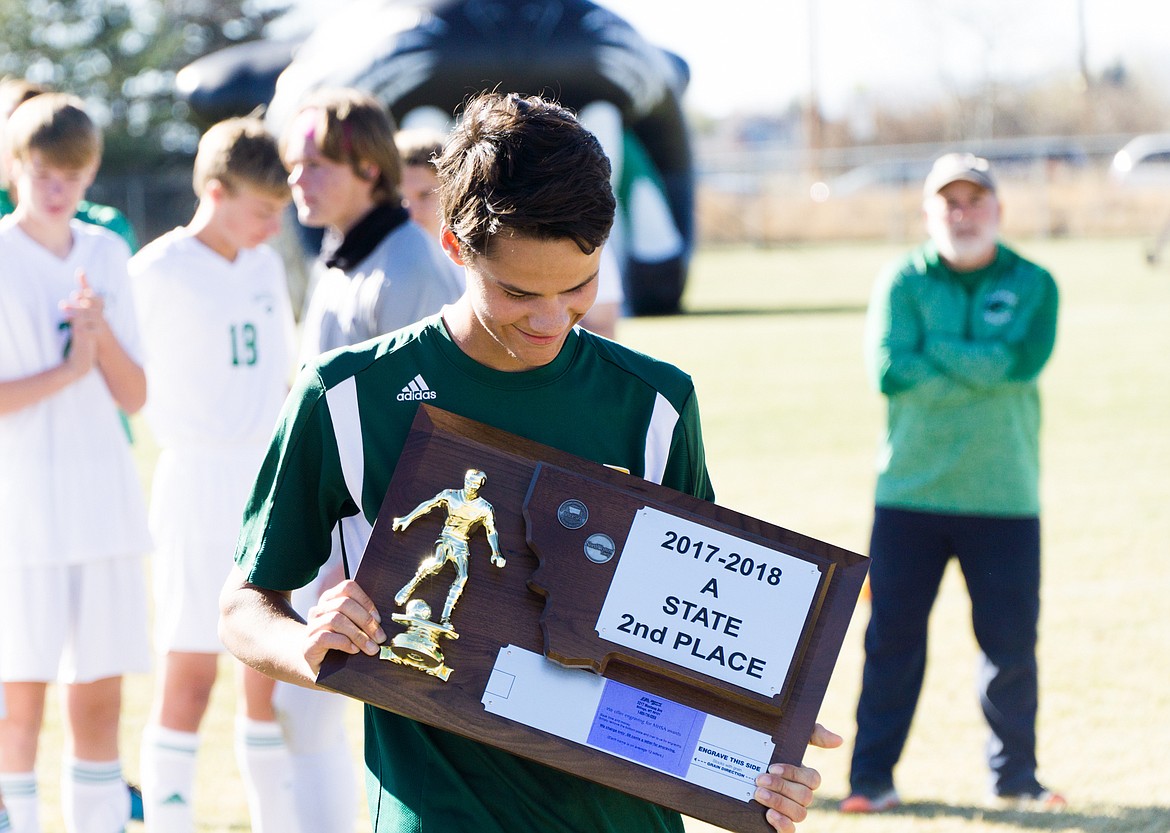 Quinten Joos accepts the Bulldogs&#146; runner up plaque during the Class A State Championship match in Belgrade. (Daniel McKay photos/Whitefish Pilot)