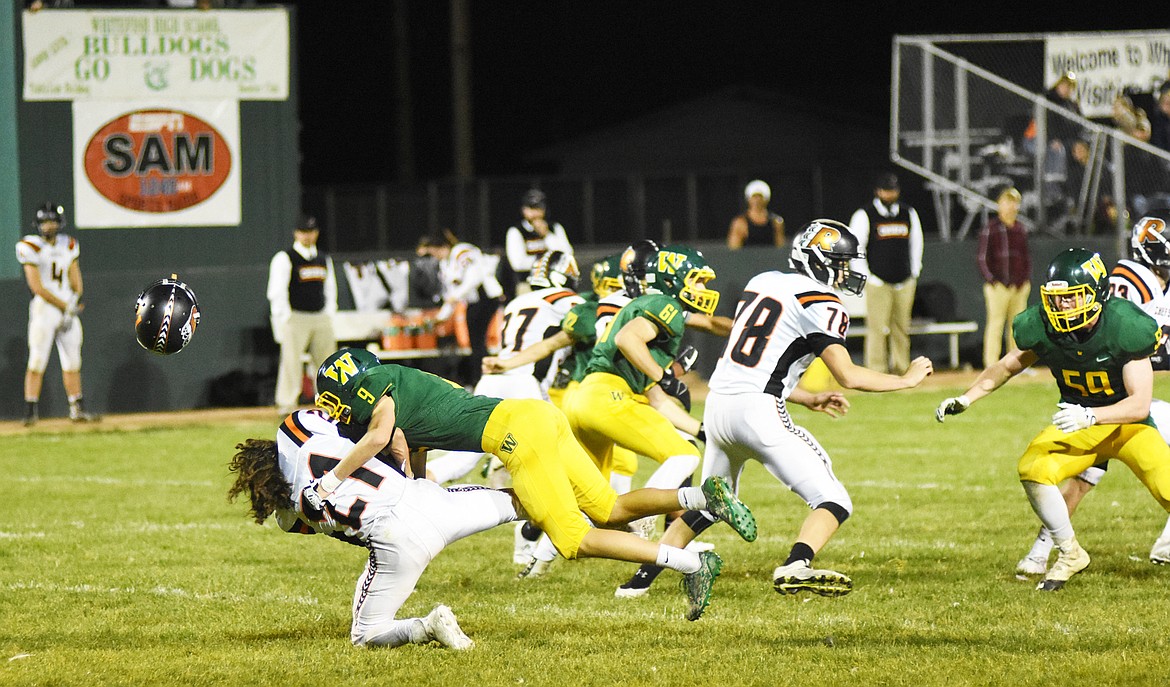 Josh Dudley crushes a Ronan kick returner during a 24-23 victory over the Ronan Chiefs.