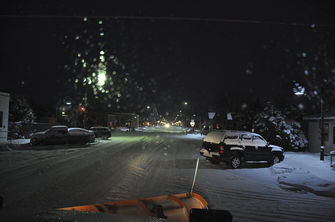 Polson city plow trucks treat roadways before, during and after storms, regardless of the time of day. (Ashley Fox/Lake County Leader)