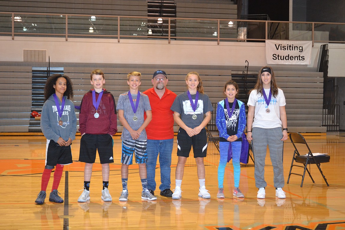 Photo by PAT BRADEN
Pictured from left are the Coeur d&#146;Alene Elks Hoop Shoot medalists in the boys 12-13 age group &#151; bronze medalist Raja Olivieri, runner-up Jesse Brown and champion Kolton Mitchell, Hoop Shoot Director Rick Alexander Jr., girls 12-13 gold medalist Alexis Heath, runner-up Madison Mitchell and third-place finisher Karina Sande.