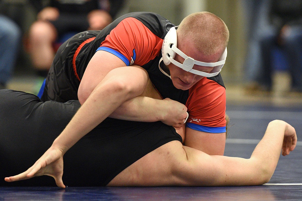 Bigfork's Logan Kaminsky works toward a pin of Eureka's Simon Gromberg at 205 pounds at Bigfork High School on Tuesday. (Casey Kreider/Daily Inter Lake)