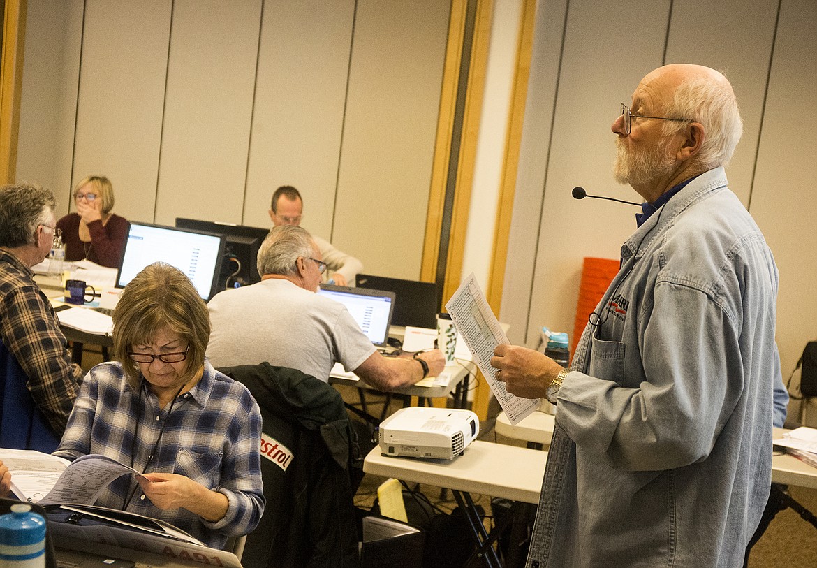 Warren Fisher gives instructions to around 20 volunteers during an AARP Tax Aid class Wednesday afternoon at Silver Lake Mall. (LOREN BENOIT/Press)