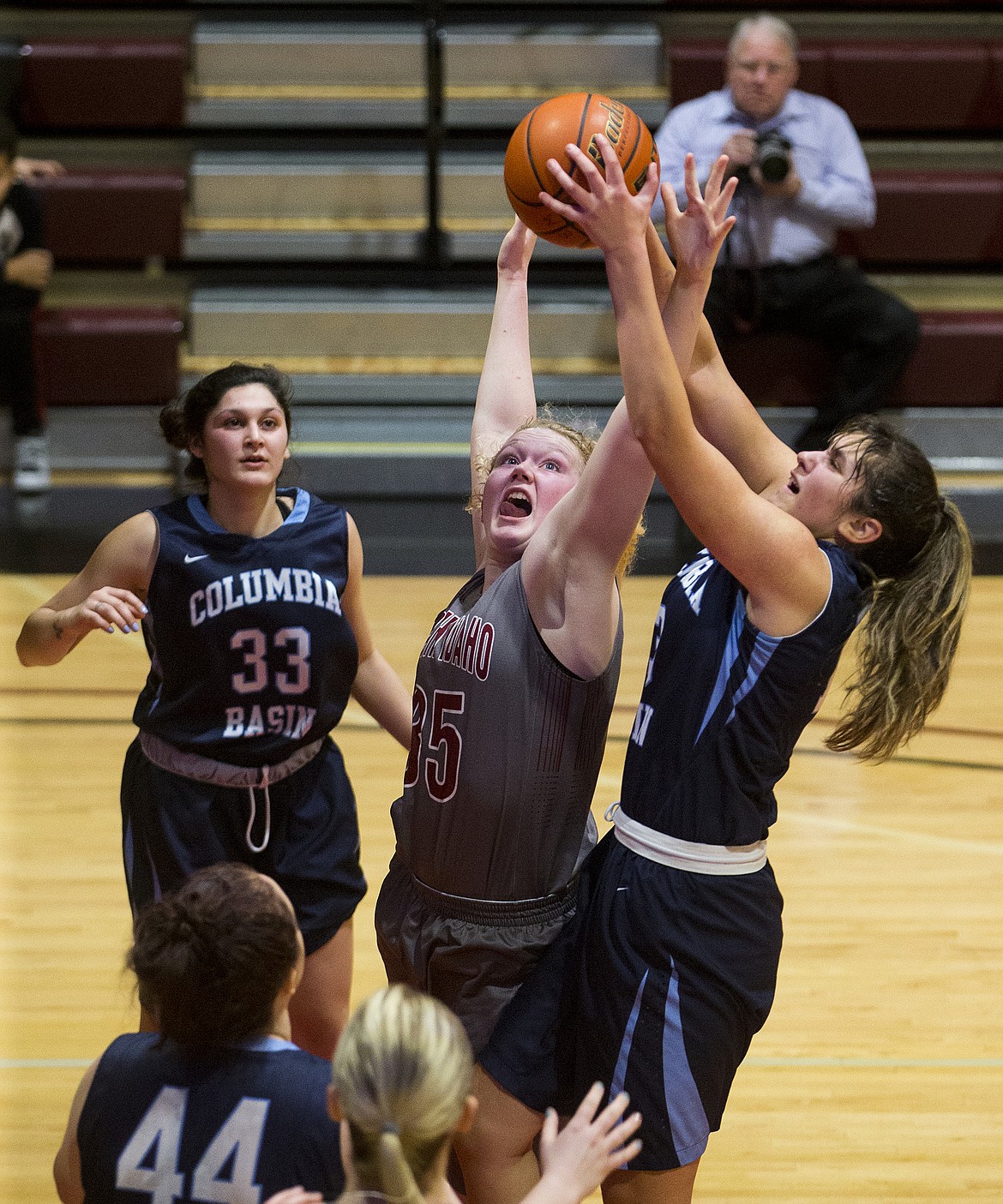 Sydney Hovde of North Idaho College, center, goes for a rebound against Columbia Basin College Wednesday night at NIC.  (LOREN BENOIT/Press)