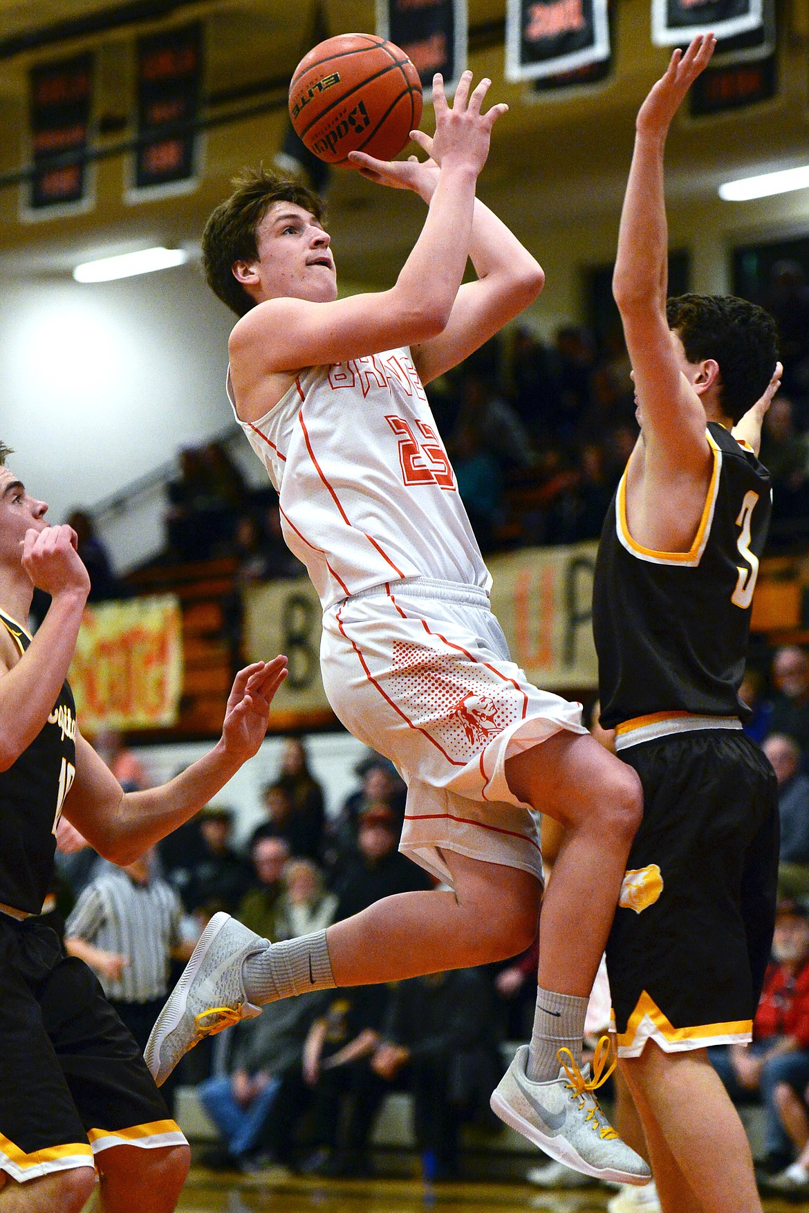 Flathead's Eric Seaman drives to the hoop against Helena Capital on Friday. (Casey Kreider/Daily Inter Lake)