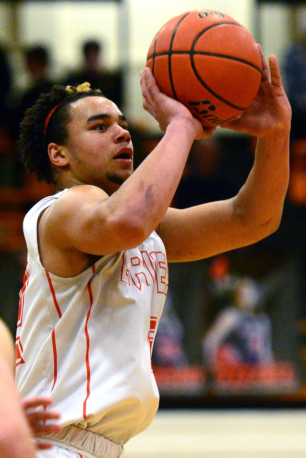 Flathead's Anthony Jones releases a three-pointer during the fourth quarter against Helena Capital on Friday. (Casey Kreider/Daily Inter Lake)