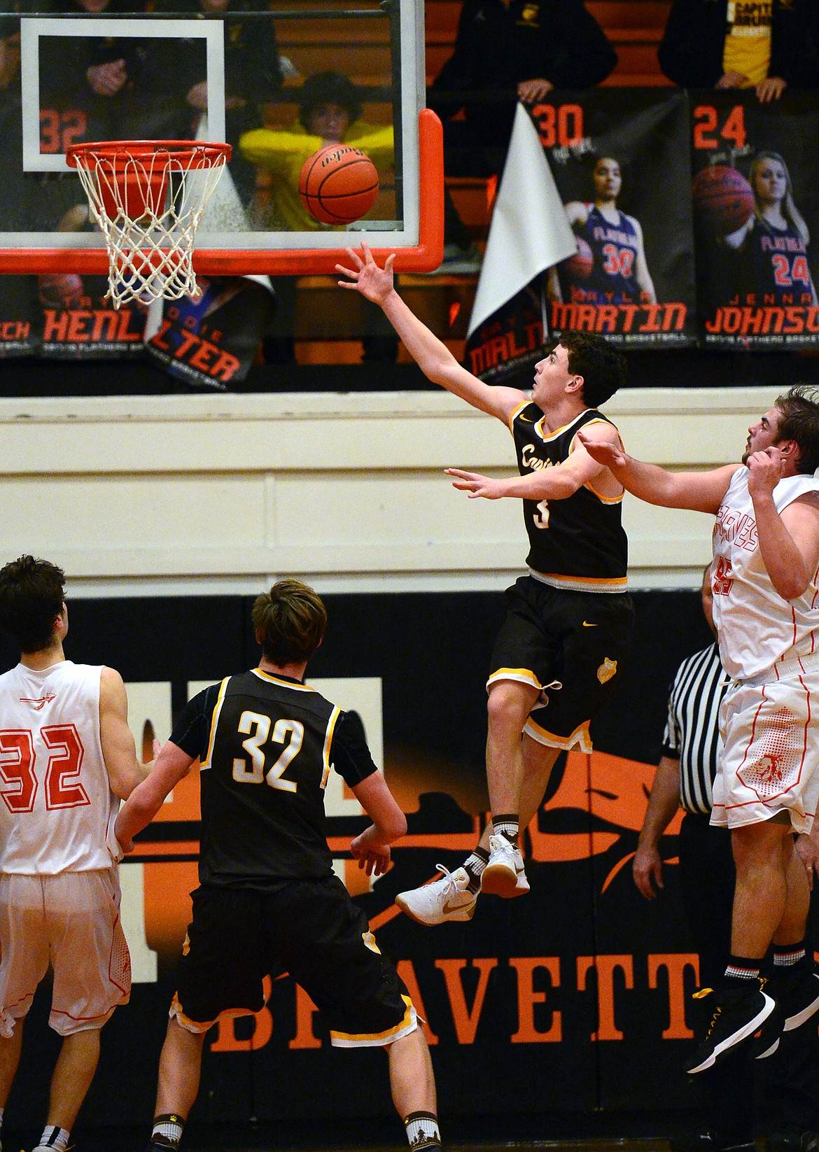 Helena Capital's Parker Johnston sinks the game-winning bucket in overtime to beat Flathead, 53-51, at Flathead High School on Friday.(Casey Kreider/Daily Inter Lake)