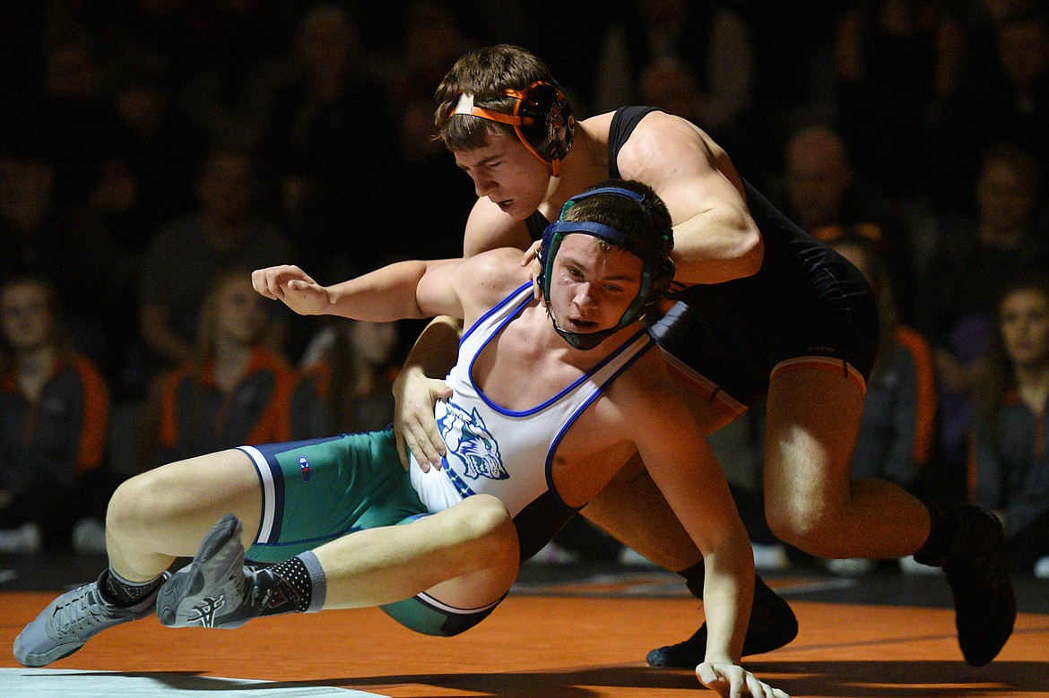 Flathead's Tucker Nadeau, top, wrestles Glacier's Wes Palmer at 182 pounds on Thursday at Flathead High School. Nadeau won by pin. (Casey Kreider/Daily Inter Lake)