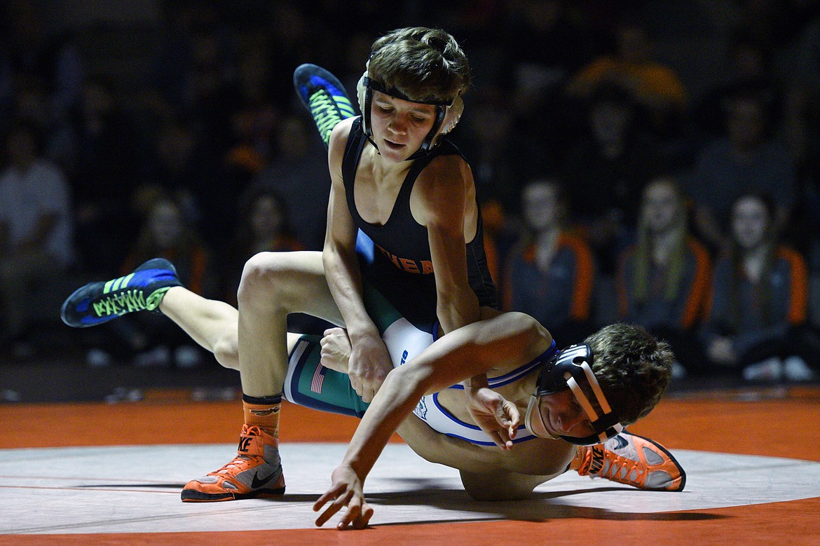 Flathead's Brendan Barnes wrestles Glacier's Dylan Miller at 103 pounds on Thursday at Flathead High School. Barnes won by pin. (Casey Kreider/Daily Inter Lake)