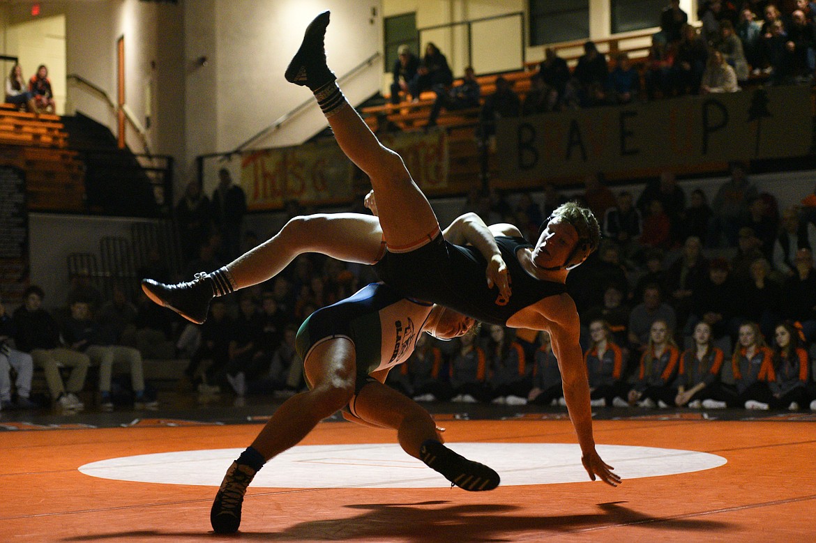 Glacier's Caden Gilmond throws Flathead's Garrett Rieke at 160 pounds on Thursday at Flathead High School. Rieke won by pin.