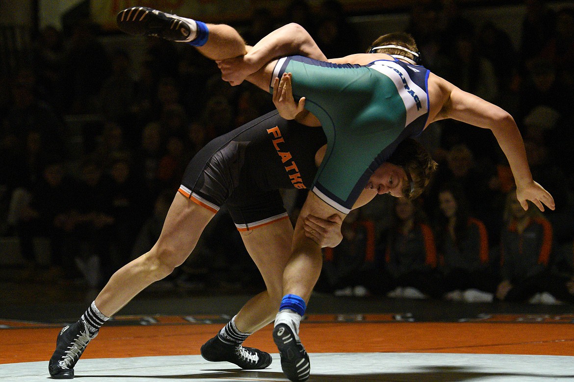 Flathead's Garrett Rieke wrestles Glacier's Caden Gilmond at 160 pounds on Thursday at Flathead High School. Rieke won by pin. (Casey Kreider/Daily Inter Lake)