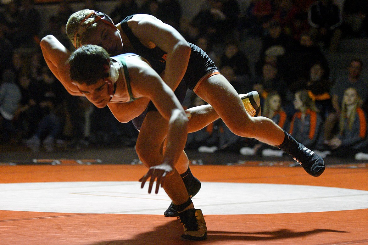 Flathead's Bo Meyer, top, wrestles Glacier's Cole McCollam at 138 pounds. Meyer won by major decision. (Casey Kreider/Daily Inter Lake)