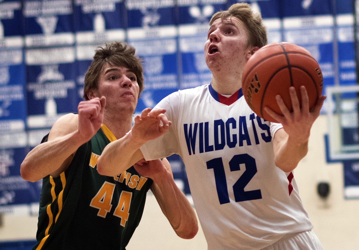 Drew Morgan goes up for two of his 14 points against the Bulldogs Thursday. (Jeremy Weber photo)