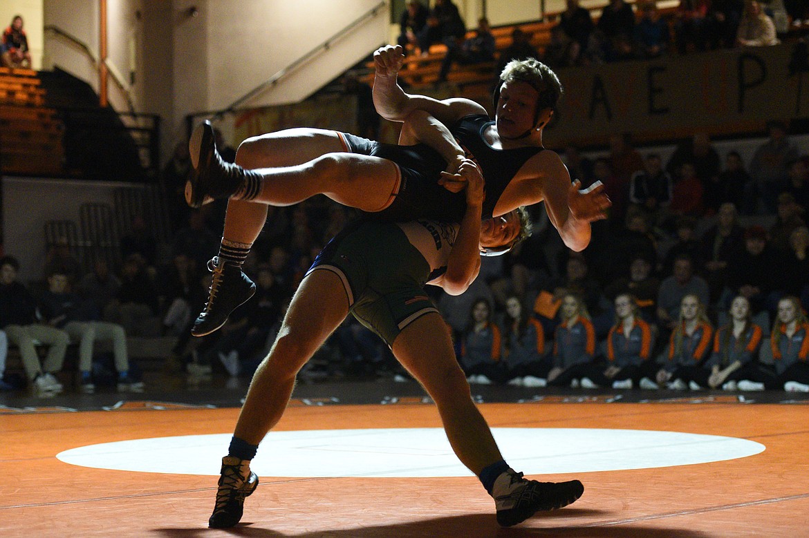 Glacier's Caden Gilmond throws Flathead's Garrett Rieke at 160 pounds on Thursday at Flathead High School. Rieke won by pin.