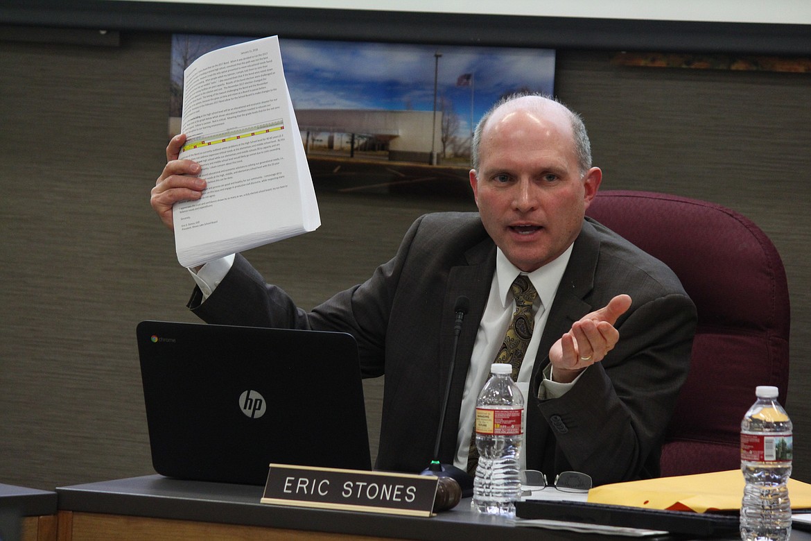 Cheryl Schweizer/Columbia Basin Herald

Eric Stones displays a position paper he wrote on the possibility of redirecting money from a bond passed in February 2017 to build, among other things, a new high school.