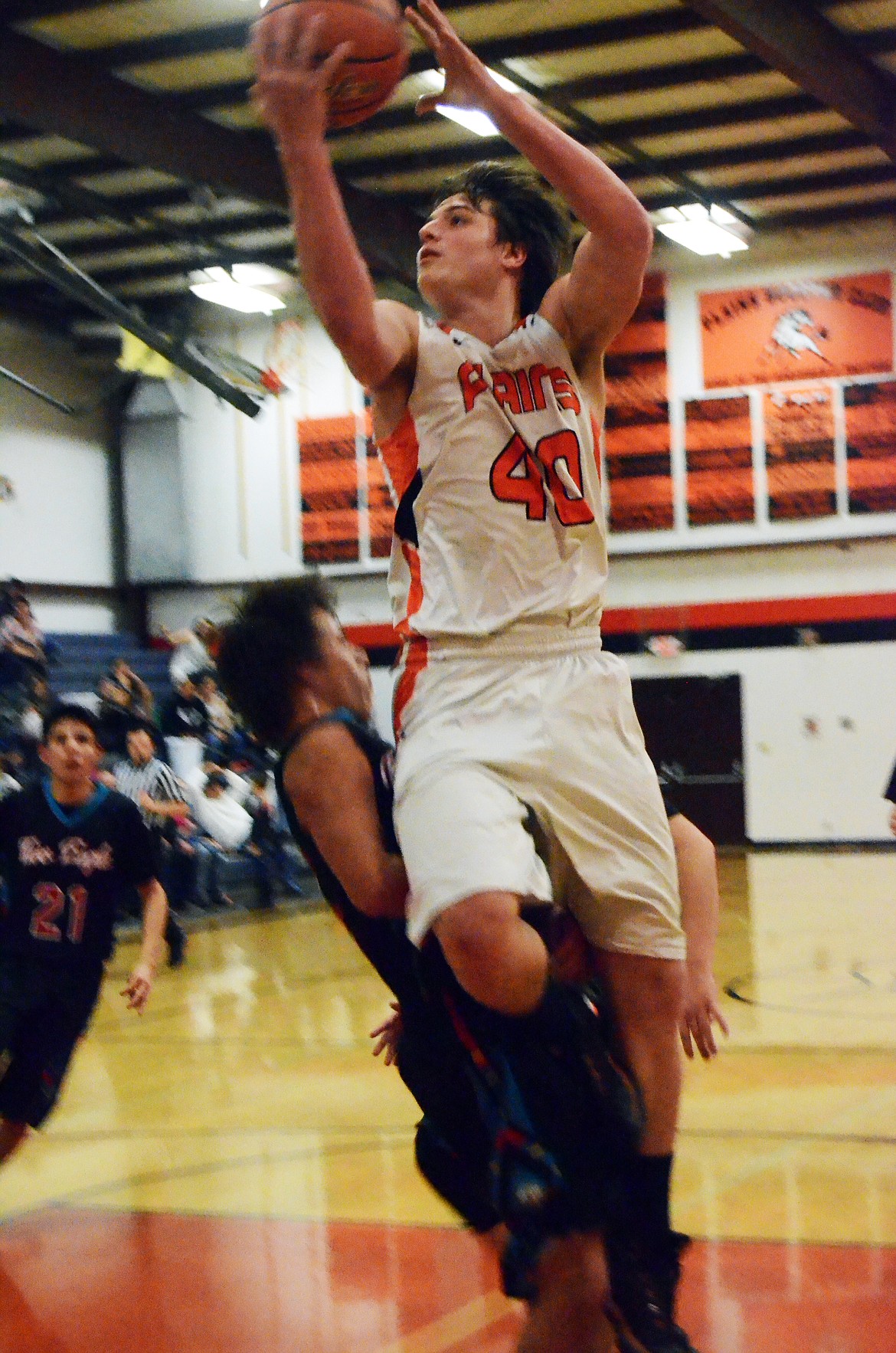 Jay Vonheeder (40) plows through the Eagle defense to sink a basket. (Erin Jusseaume/ Clark Fork Valley Press)