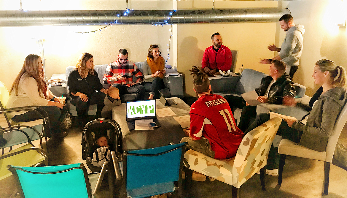 Photo illustration by TRENT GRANDSTAFF/KCYP
Kootenai County Young Professionals members discuss how to gather new members together and receive their feedback on KCYP, and where they want it to go in the future, during a meeting in late 2017. Standing up in the gray sweatshirt is KCYP president James Perkinson speaking with member Octavian Rivas.