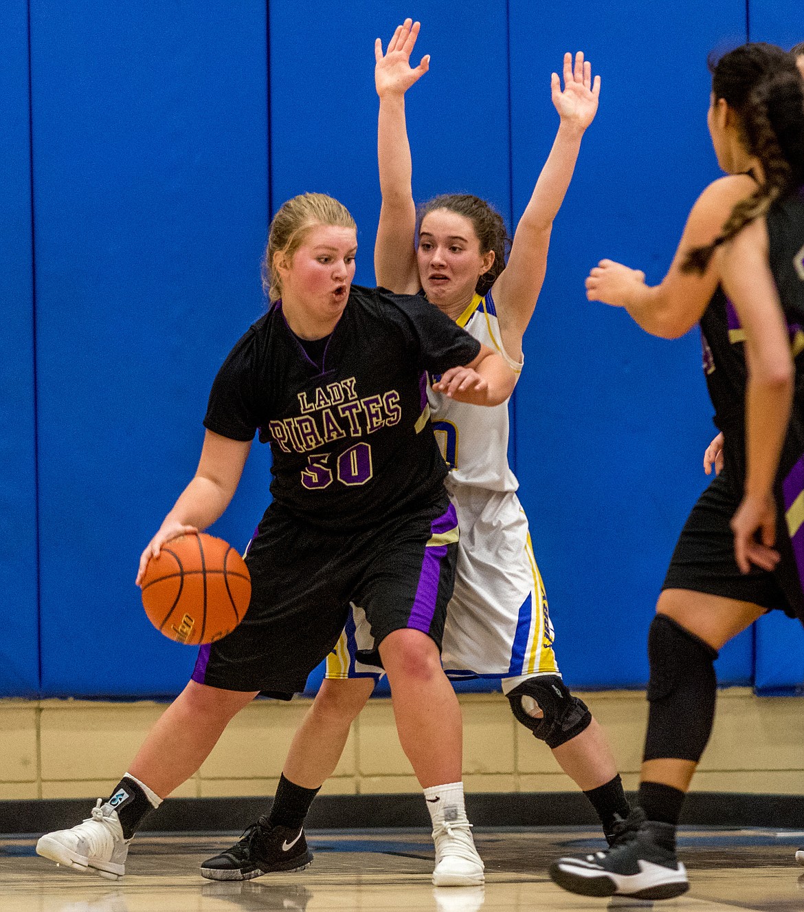 Libby's Emma Gruber defends against Polson's Jaycee Frydelund Saturday. (John Blodgett/The Western News)