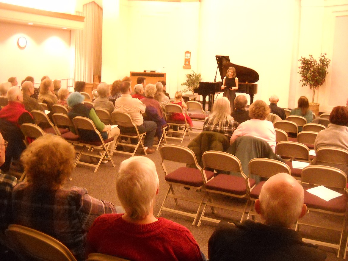 Amy Grinsteiner talks to the crowd during her Jan. 9 performance at the LDS Church in Superior where she was joined by Superior native, Scott Billadeau. (Photo courtesy of the Mineral County Performing Arts Center).