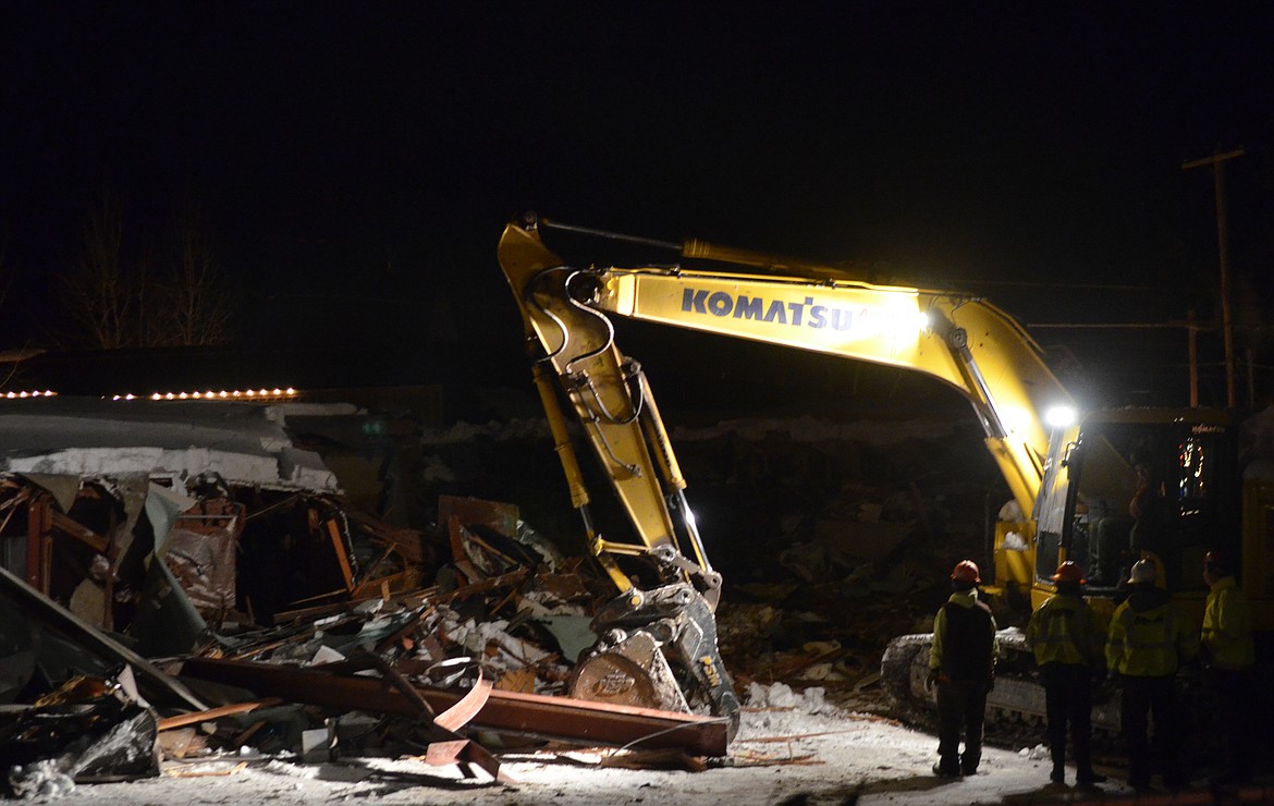 Crews began demolishing the Frank Lloyd Wright Building on Central Avenue Wednesday evening. (Heidi Desch/Whitefish Pilot)