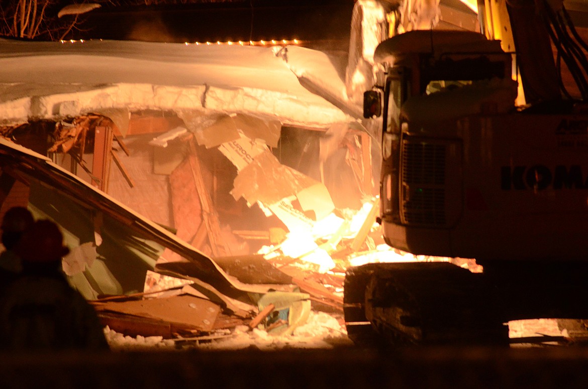 Crews began demolishing the Frank Lloyd Wright Building on Central Avenue Wednesday evening. (Heidi Desch/Whitefish Pilot)